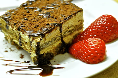 chocolate cake beside strawberries on plate thumbnail