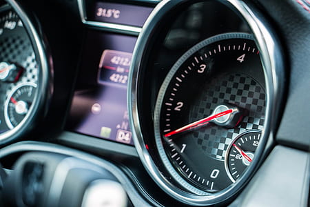 closeup photo of black vehicle tachometer at 1 and 1/2 thumbnail