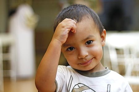boy in white top smiling thumbnail