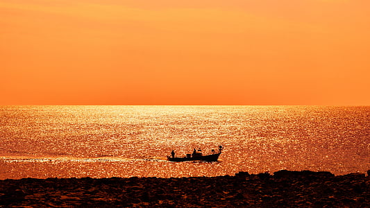 silhouette of boat during sunset thumbnail