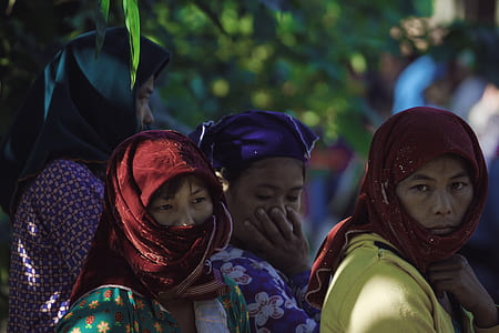 four woman resting under tree thumbnail