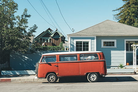brown Volkswagen T2 van parked near wooden house during daytie thumbnail