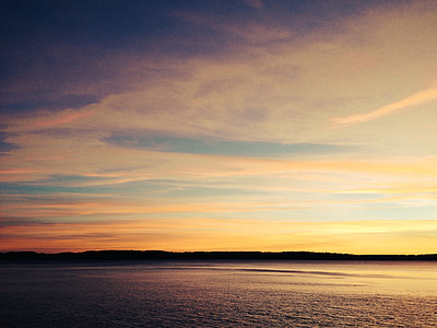 seascape photography of sea during sunset thumbnail