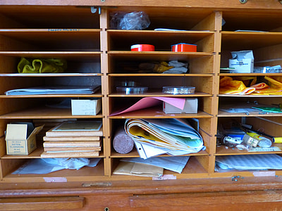 art materials displayed on wooden shelving thumbnail