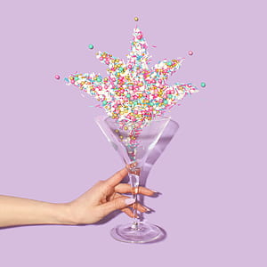 person holding clear footed glass vase thumbnail