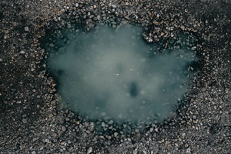 close-up photography of road bunker with water thumbnail
