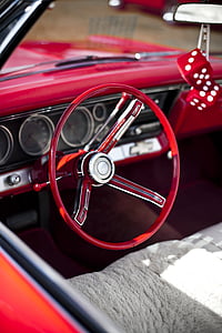 selective focus photography of red vehicle steering wheel thumbnail