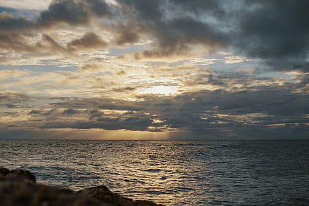 Sea Under Gray Cloudy Sky during Dawn thumbnail