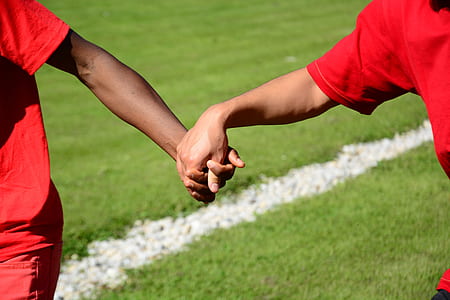 two men holding hands thumbnail