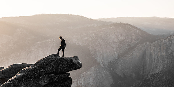 landscape photography of man on mountain thumbnail