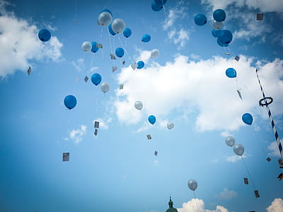 photo of blue and white balloons on sky thumbnail