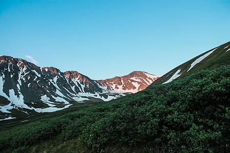 landscape photograph of mountain ranges covered with snow thumbnail