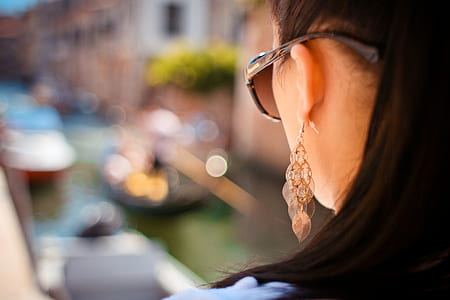 Woman Wearing Pendant Earrings and Sunglasses thumbnail