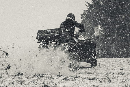 person riding on ATV drifting on grass thumbnail