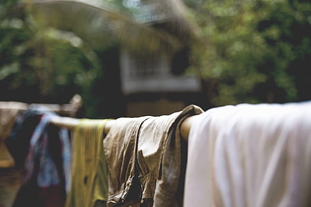 selective focus photography of hanged clothes thumbnail