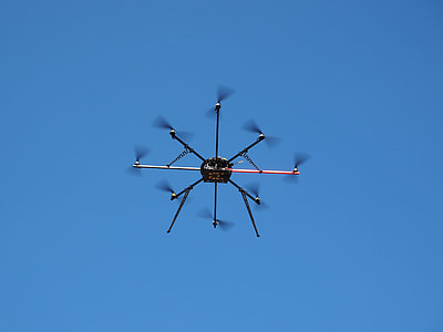 black drone flying above thumbnail