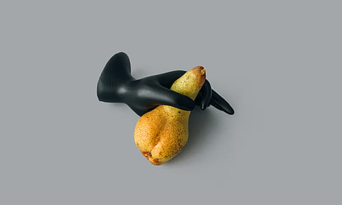 yellow fruit and black mannequin hand thumbnail