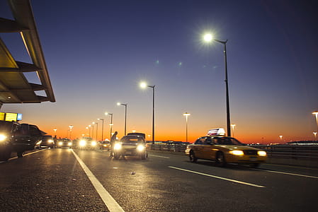 Cars passing through toll collection lanes in the evening thumbnail
