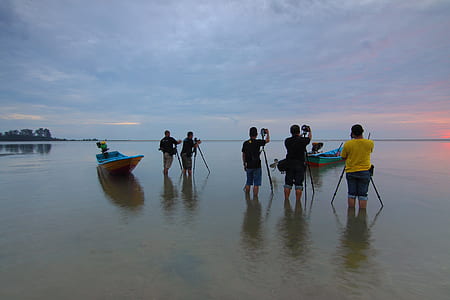 People on Beach Against Sky thumbnail
