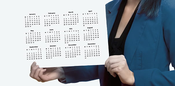 woman holding white calendar thumbnail