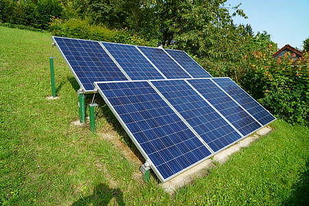 two black solar panel on green grass thumbnail