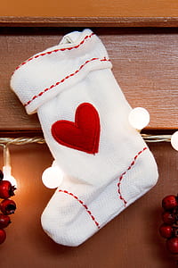 hanged white and red heart-embroidered Christmas stocking thumbnail