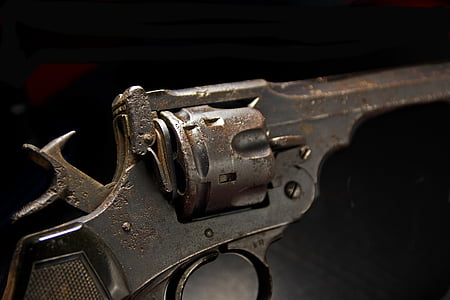 selective focus photography of black revolver thumbnail