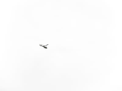 white helicopter soaring in sky at daytime thumbnail