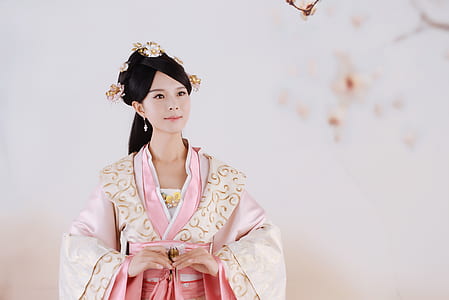 woman wearing pink and white dress smiling thumbnail