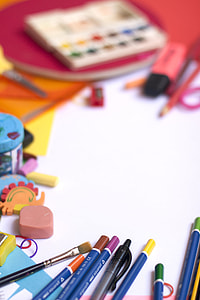 selective focus photography of pile of pen and brush thumbnail