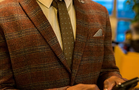 Person Wearing Red and Gray Plaid Suit Jacket thumbnail