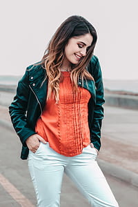woman in black bicker jacket smiling thumbnail
