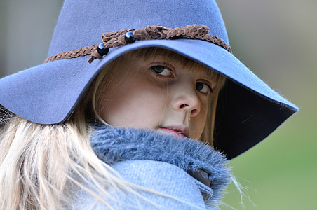 selective focus photography of girl wearing blue sunhat thumbnail