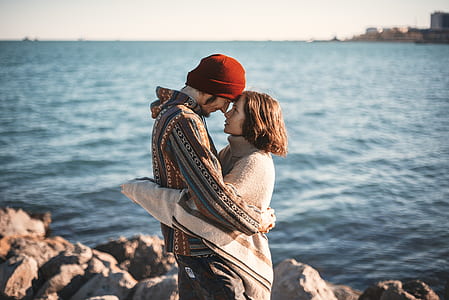 man and woman hugging near the shore thumbnail