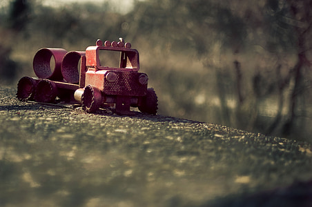 brown scrap metal truck on concrete surface thumbnail