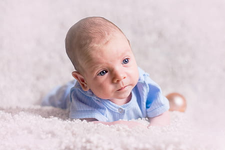 baby on white textile thumbnail