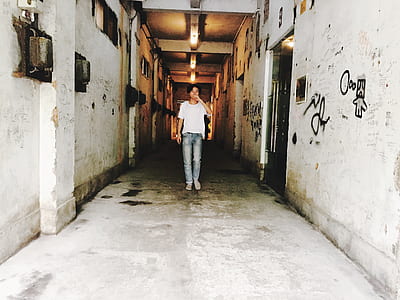 person standing on white hallway thumbnail
