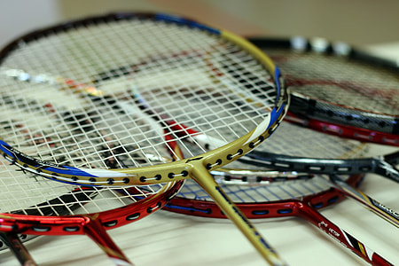 assorted-color badminton rackets thumbnail