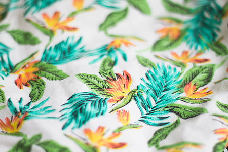 white, blue, green, and orange floral textile thumbnail