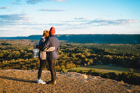 two person standing on mountain hugging each other thumbnail