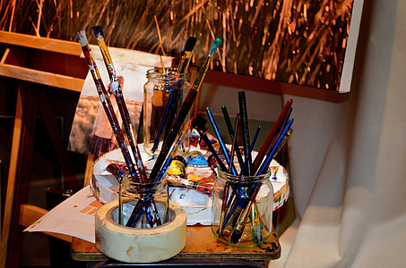 photo of paint brushes in bottles thumbnail