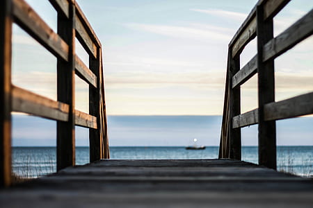 view of brown dock facing body of water thumbnail