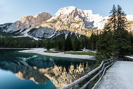 body of water beside mountain thumbnail