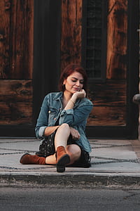 woman sitting on gray floor near the door thumbnail