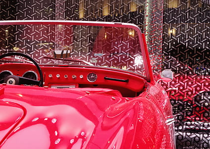 close up photography of red convertible coupe thumbnail