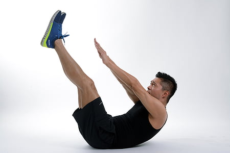 man in black shirt and black gym shorts doing ab exercise thumbnail