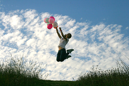 girl jumping with ballons thumbnail