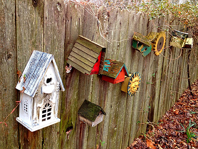 miniatuyre houses on fence thumbnail