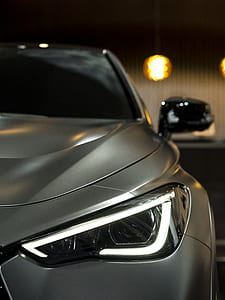 selective focus photography of vehicle headlight thumbnail