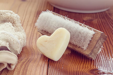 white heart soap near brown brush thumbnail